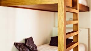 A clicked photo showcases the staircase leading to a double-decker bed.