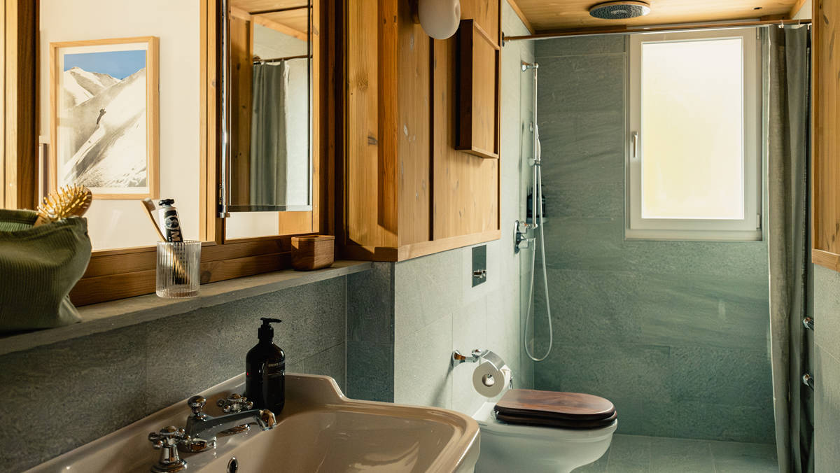A photo showcases a modern bathroom with all essentials neatly arranged and properly placed throughout.