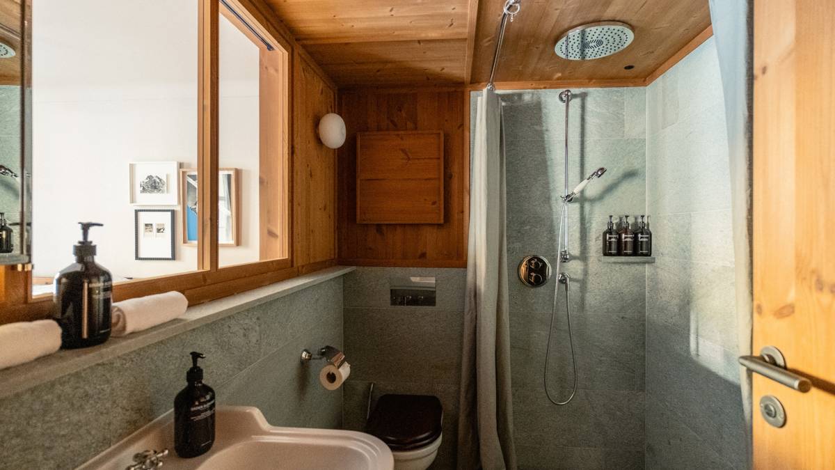 A photo captures a modern bathroom, with all essentials carefully arranged and neatly placed throughout.