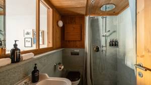 A photo captures a modern bathroom, with all essentials carefully arranged and neatly placed throughout.