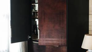 A clicked photo shows beautifully finished shelves in light brown color with open shelf doors.